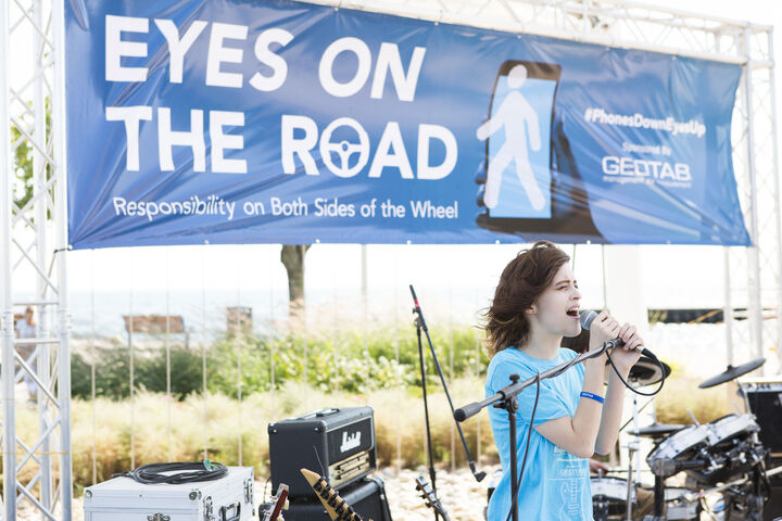 Geotab concert. Girl in the blue shirt is singing on the stage.